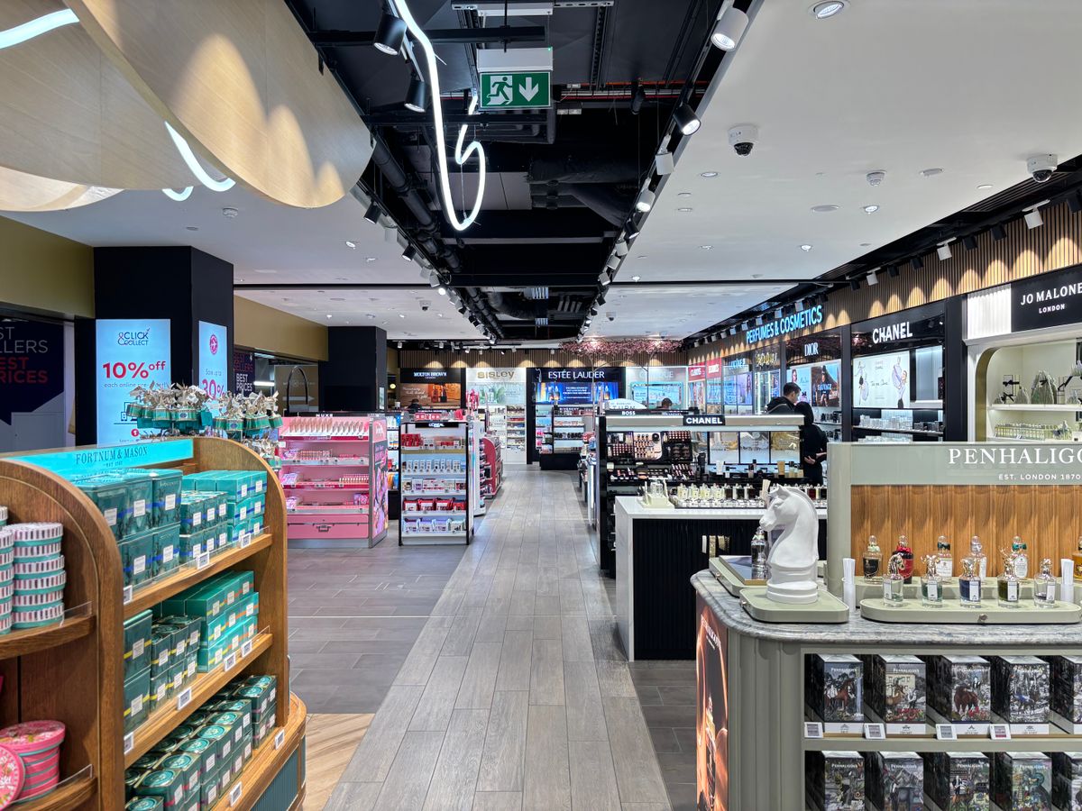 Retail store interior with stocked beauty-product displays and clear aisles